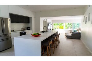 Modern, fully equipped kitchen with an extra large island. 