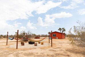 Exterior of Cryptic from the fire pit and hammock area