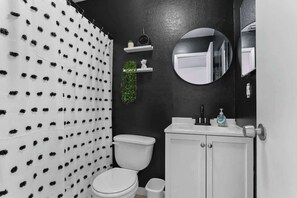 Full bathroom with bathtub and shower