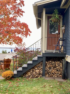 Firewood stacked beneath entrance