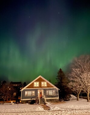 Northern lights above house