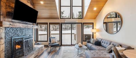 Open concept living room with golf course views.