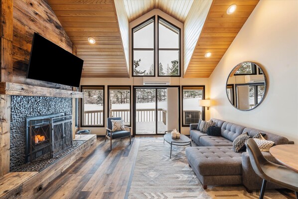 Open concept living room with golf course views.