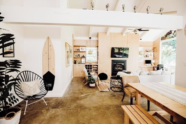 Boho modern, dining room. Custom made built in wine rack, wet-bar, local art