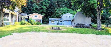 50 feet of lake front, including a fire pit, dining table, and fire pit!