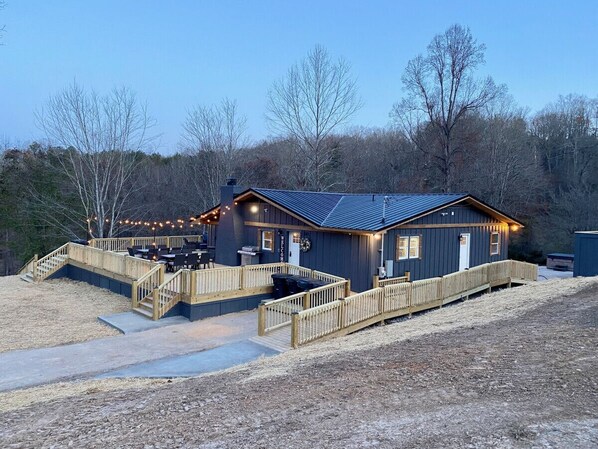 Dusk view of the ramp and pads stretching the full length along the cabin's rear