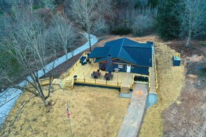 Ramps from the driveway lead to both side and rear entrances and 3000 sq ft deck