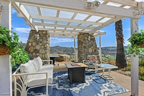 Pool sitting area with awesome view of the valley.