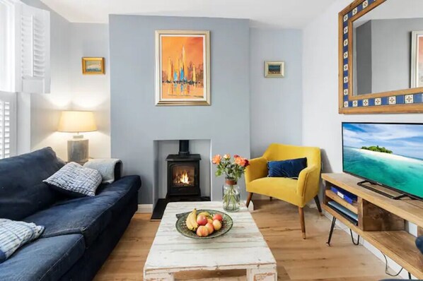 Lounge with comfy sofa, log burner and Smart TV