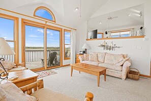 Living Room with Deck Access and Sound Views on Third Level