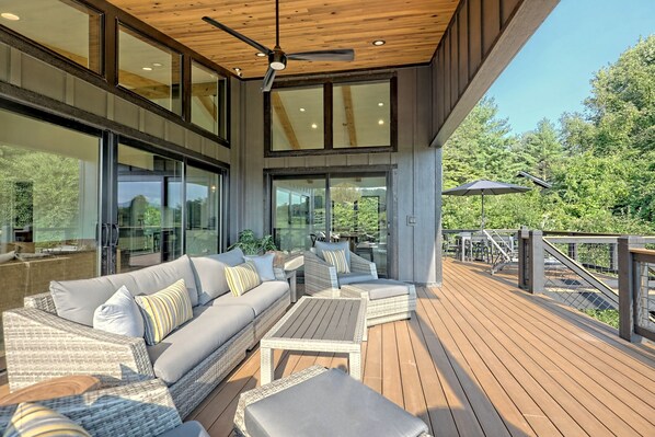 Lots of comfortable seating on the front deck for taking in the view as you sip your wine or, drink your beverage of choice