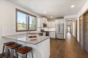 Fully stocked kitchen with barstool seating! 