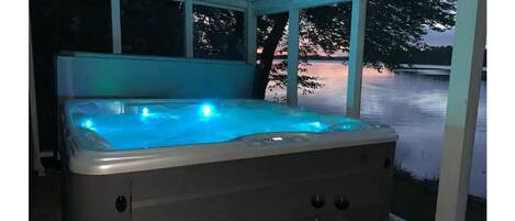 Relax with a dip in the hot tub overlooking the water!
