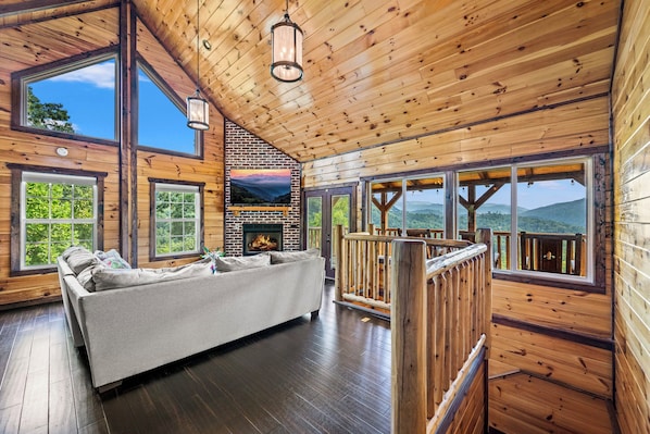 Bird's eye view of luxury – the living space showcases a harmonious blend of rustic wood and contemporary design elements