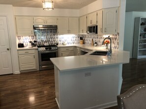 Kitchen fully stocked with all your needs in mind.