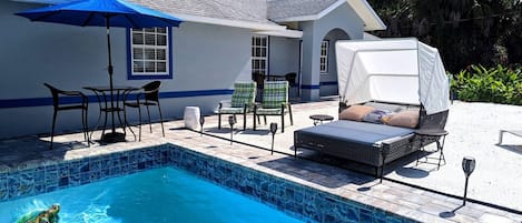 Pool, Daybed, sand beach area and guest house