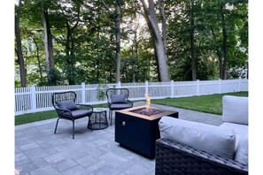 Large patio and private yard back up to beautiful wooded conservation land