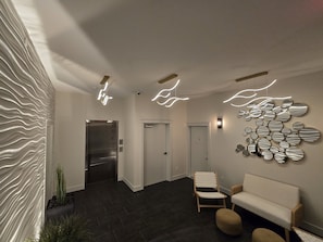 Lobby as you walk in the front door to the elevator at night.