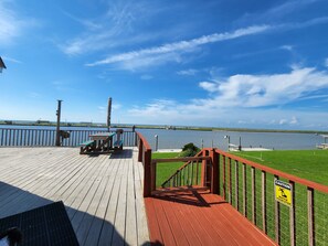 Deck facing backyard and views of intracoastal waterway and Gulf of Mexico 