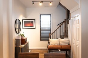 Stylish landing greets you as you ascend the entry stairs