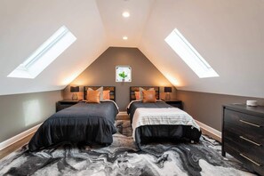 Two twin beds in this spacious room with lots of natural light