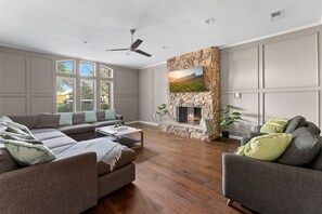 Spacious Living room with large couch and two convertible chairs