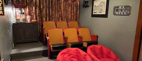 Enjoy a one of a kind popcorn movie night in the vintage theater room!