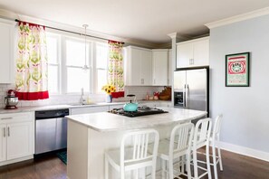 Fully equipped kitchen. Seating for 4 at the kitchen island.