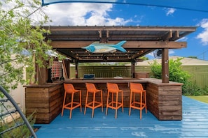 Outdoor bar with grill, lights and nice fans to cool you off on those warm days
