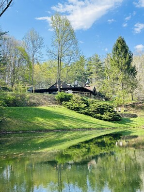 View of cabin across pond 