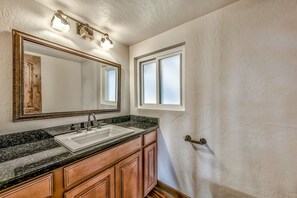 Throughout the home you'll find 3 full bathrooms and a half-bath.