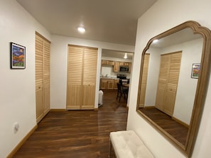 Entry way with large mirror and shoe bench