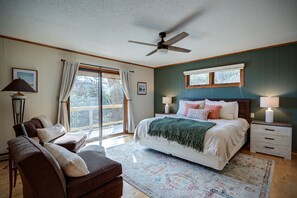 The master bedroom with a king bed, private entrance and attached bathroom