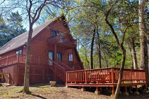 Exterior view with deck and hot tub