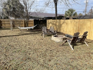 Large, Relaxing backyard with Fire pit and gas grill. 