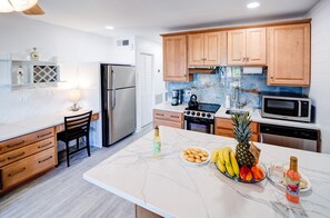 Fully stocked kitchen and working area
