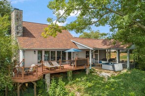 Experience the tranquility of lakefront living in this expansive home.
