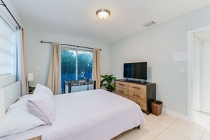 Main bedroom, with its own bathroom, and view of the deck.