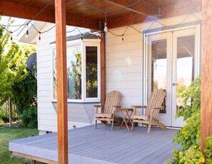 Covered deck, right outside the kitchen and in the fenced backyard.