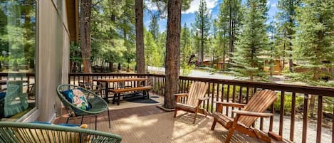 Shaded and gated deck facing beautiful, large trees.