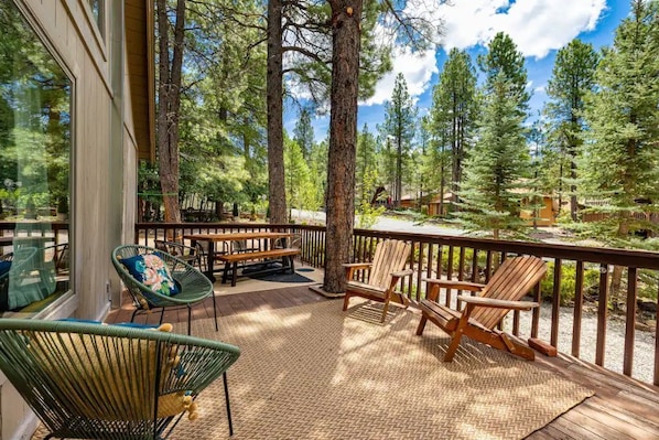 Shaded and gated deck facing beautiful, large trees.