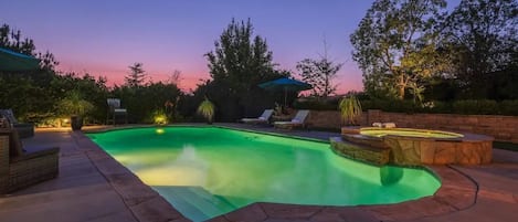 Luxurious private pool and jacuzzi! The property is beautiful at night!