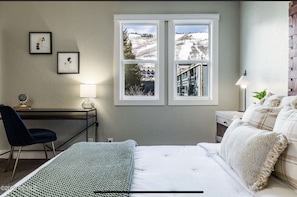 A view of the snow clad ski hills from your master bedroom!