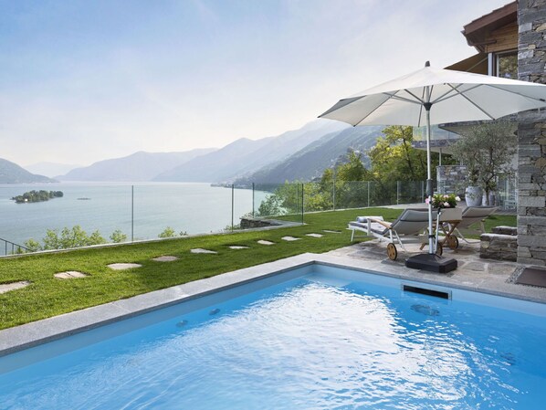 Water, Sky, Property, Plant, Building, Cloud, Swimming Pool, Outdoor Furniture, Body Of Water, Mountain