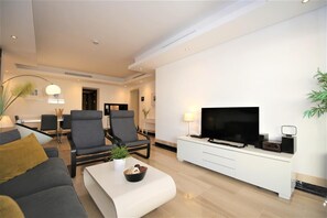 View of the lounge area with comfortable seating and flatscreen TV