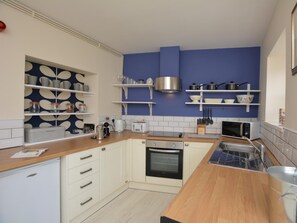 Kitchen with access onto the riverside balcony