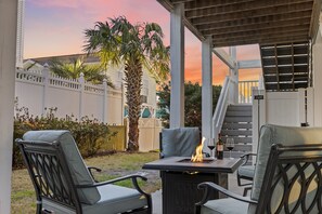 Relax outside with the ambient firepit - games room and outdoor grill are steps away