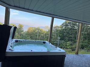 Hot tub on fully covered back porch