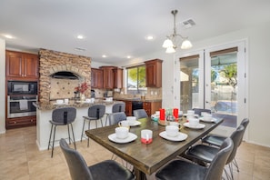 Bright and open kitchen with dining table.