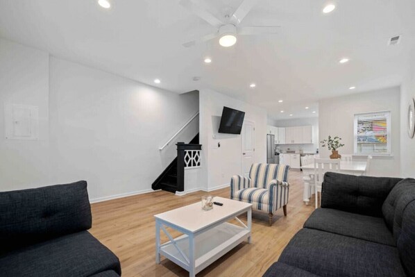 Enjoy this open-concept space with cozy seating, sleek décor, and a fully equipped kitchen—perfect for unwinding and making memories!